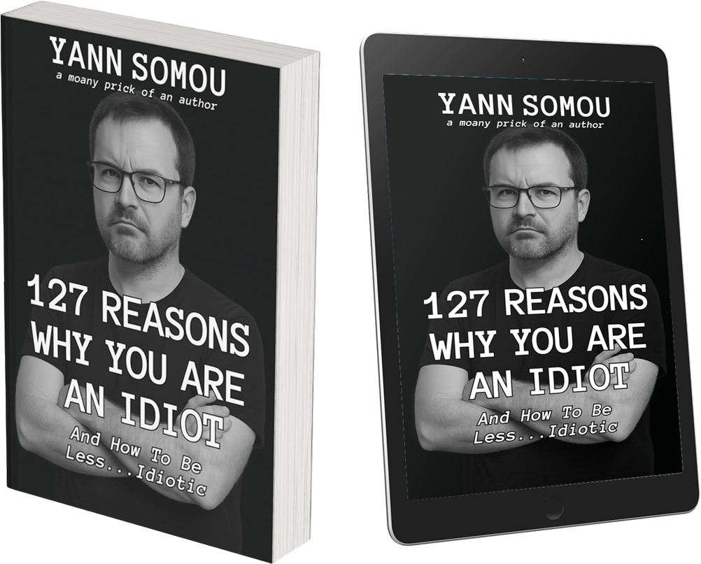 3D image of the book 127 Reasons Why You Are An Idiot by Yann Somou, shown as both a physical paperback and a digital tablet version. The cover features a black-and-white photo of the author with arms crossed, looking unimpressed. Subtitle reads: 'And How To Be Less... Idiotic.'